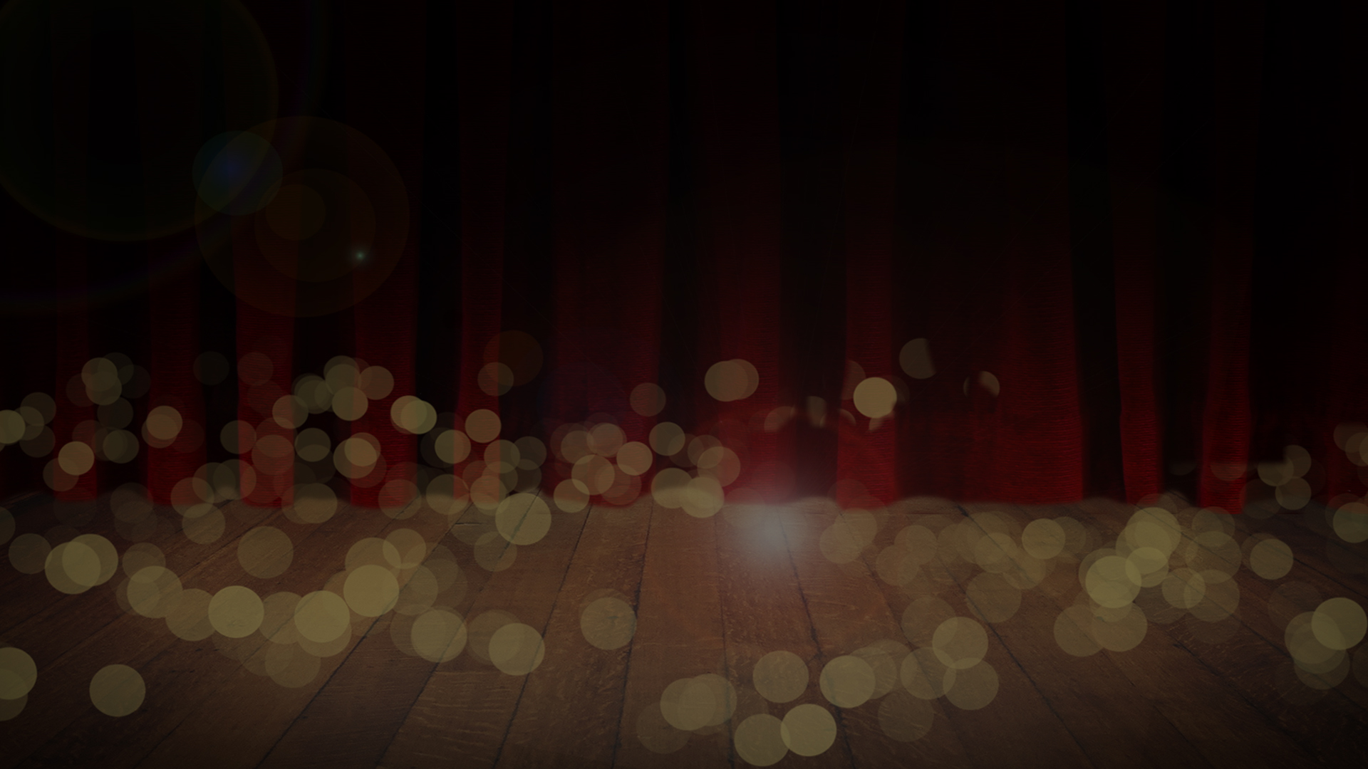 image of a dark stage background with light bokeh circles