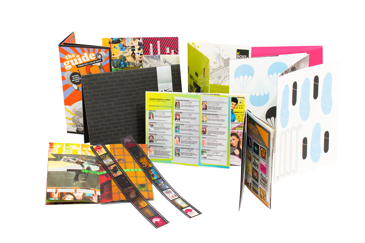 an image showing many die-cut promotional items including 35mm film strips, booklets and folded cards